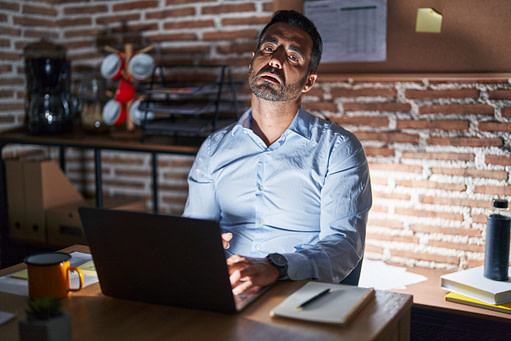 Exhausted Business Owner Exhausted Business Owner working into the night